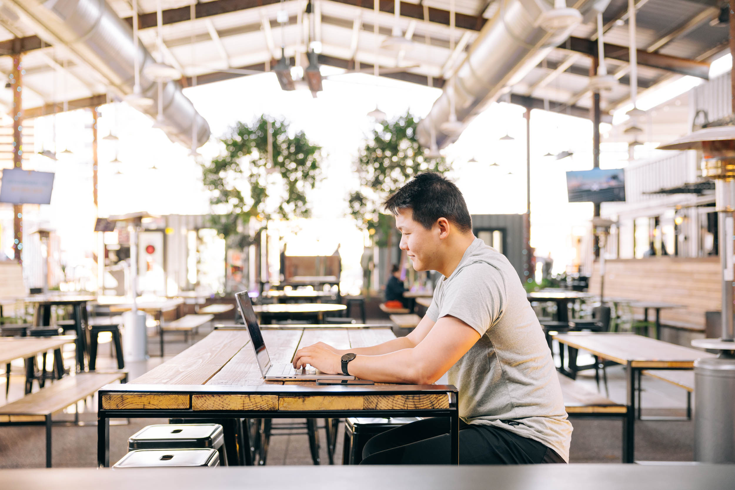 Man working on SEO for Showit website at venue