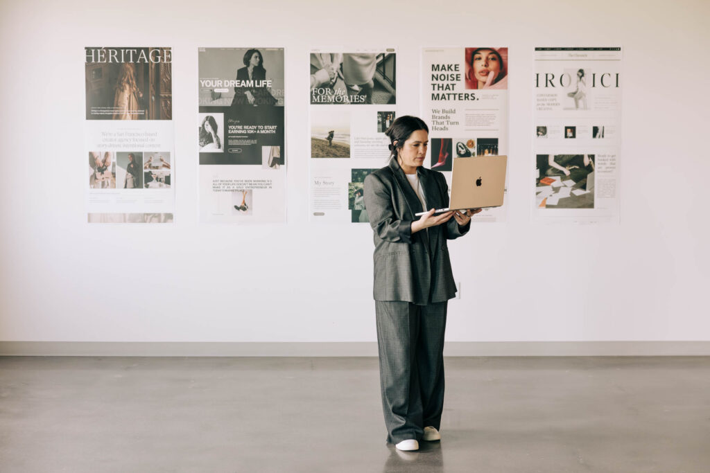 Woman working on a laptop in the 2026 Marketing Playbook blog.