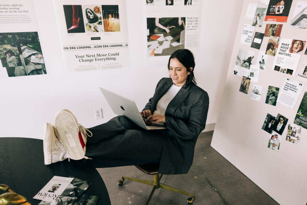 Woman working on a laptop in the Recover from Creative Burnout blog.