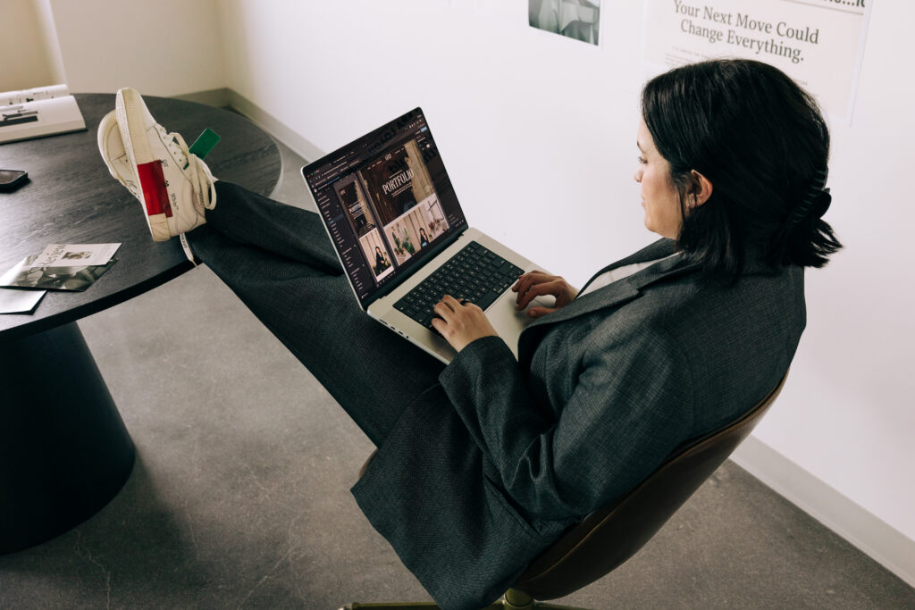 Woman working on a laptop fixing website mistakes