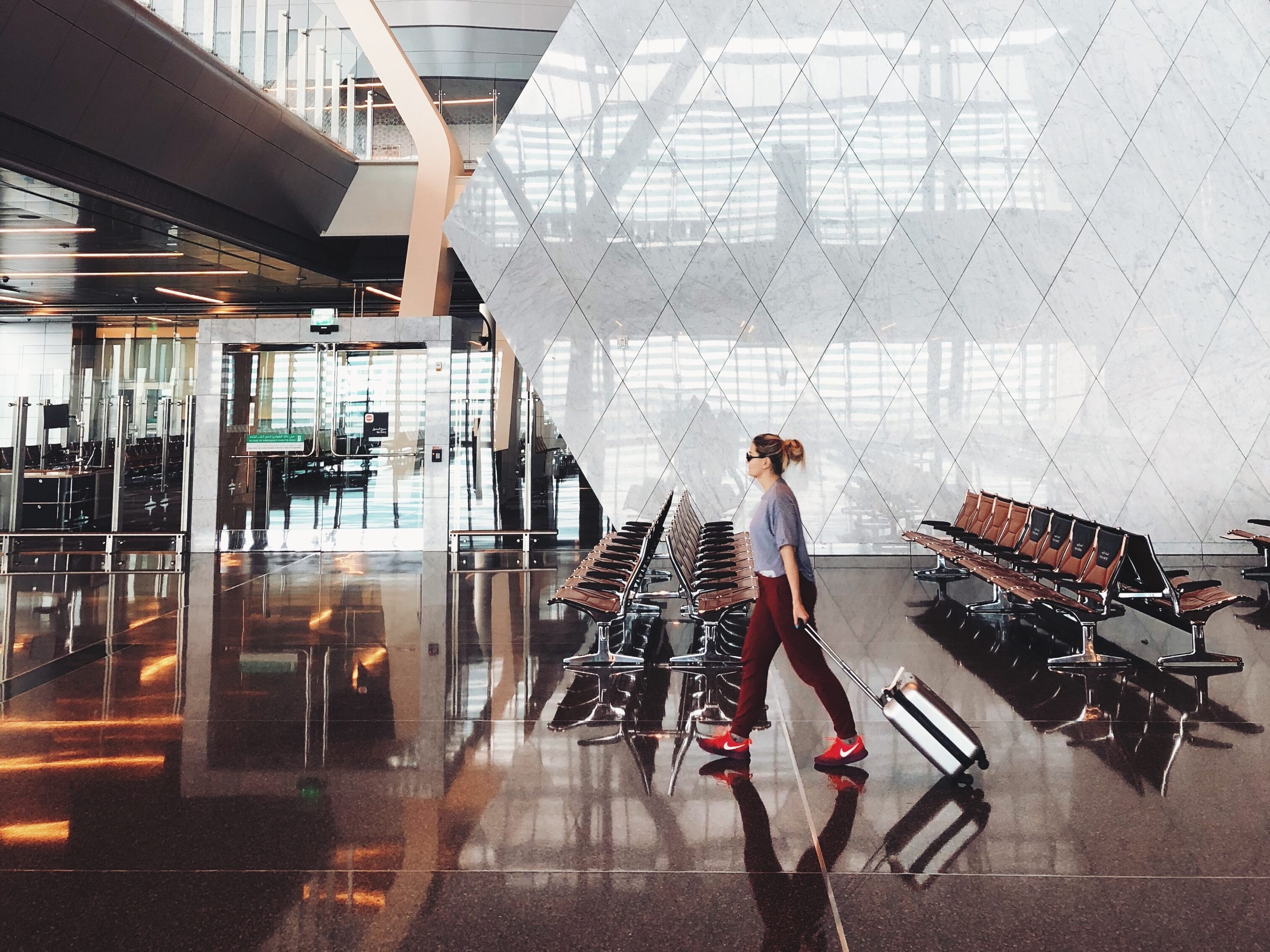 Girl walking through airport.